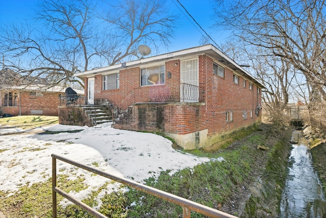 view of front of property featuring brick siding