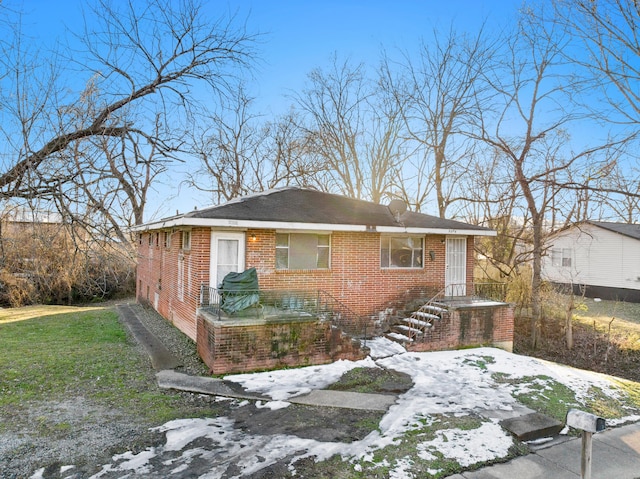 exterior space with brick siding