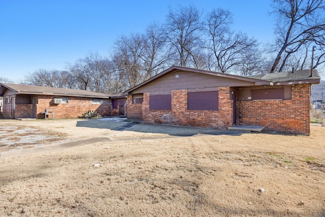 view of property exterior featuring brick siding