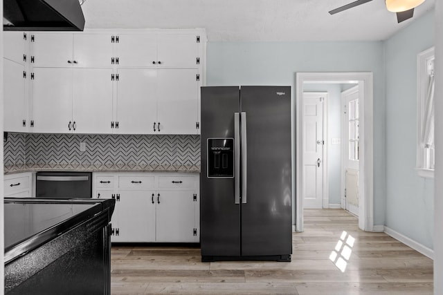 kitchen featuring white cabinets, black range with electric stovetop, stainless steel refrigerator with ice dispenser, dishwasher, and backsplash