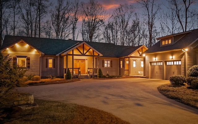 view of front facade featuring concrete driveway and an attached garage