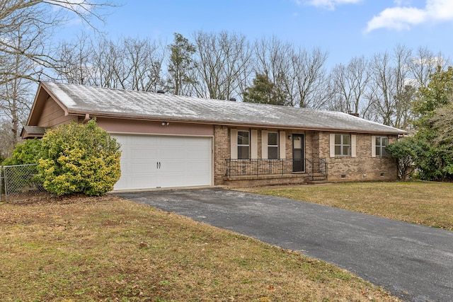 ranch-style house featuring brick siding, crawl space, a garage, driveway, and a front lawn