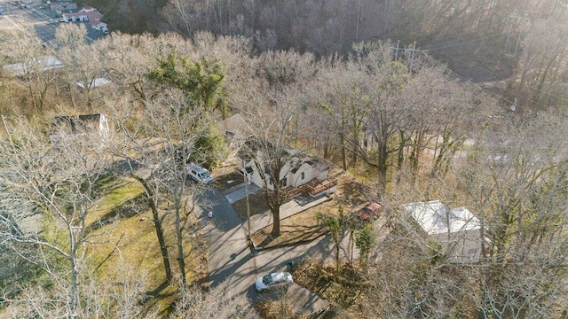 drone / aerial view featuring a forest view