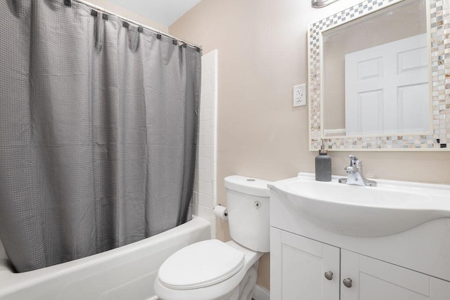 full bath featuring vanity, shower / bath combination with curtain, and toilet