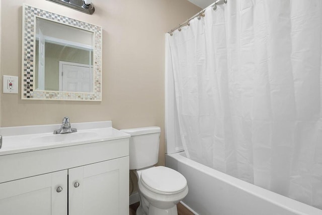 bathroom featuring shower / tub combo with curtain, toilet, and vanity