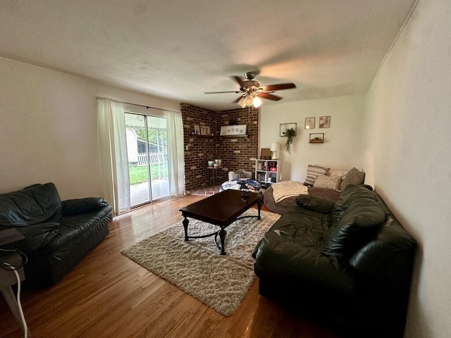 living room featuring wood finished floors and a ceiling fan