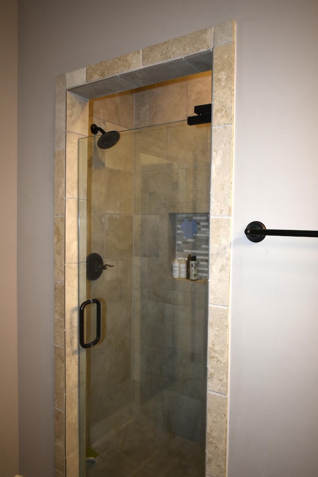 full bath with a shower stall