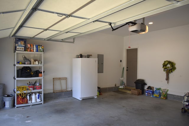 garage with electric panel and a garage door opener