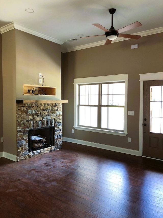 unfurnished living room with ornamental molding, a fireplace, dark wood finished floors, and baseboards