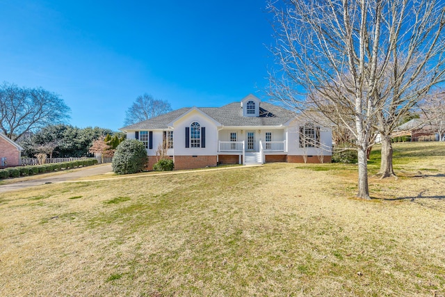 view of front of house featuring crawl space, covered porch, and a front yard