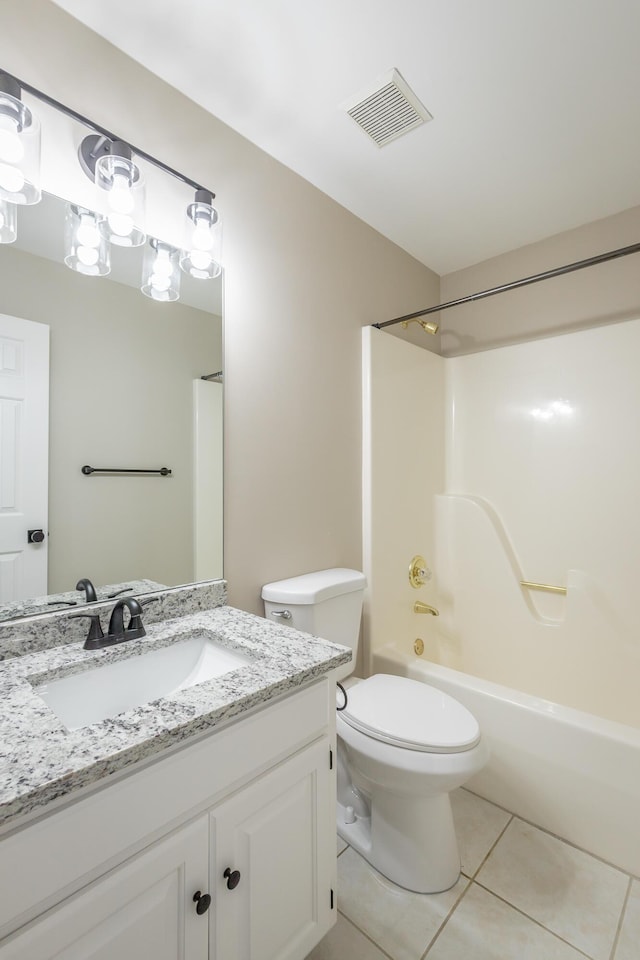 full bathroom with tile patterned flooring, toilet, vanity, visible vents, and shower / washtub combination