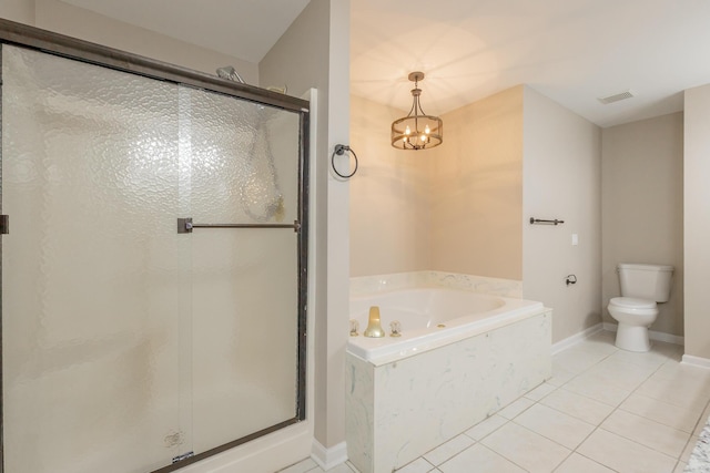 bathroom featuring a stall shower, toilet, tile patterned floors, a garden tub, and a chandelier