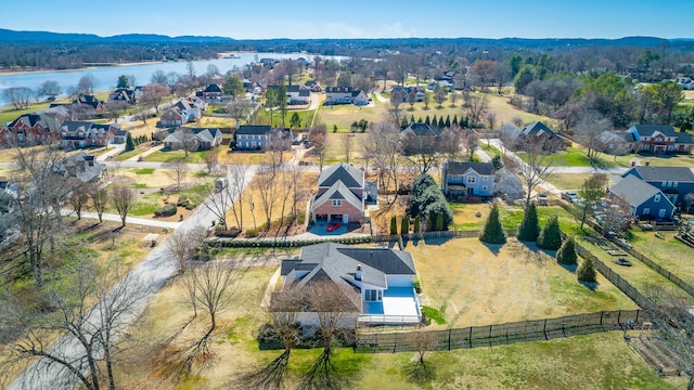 birds eye view of property with a residential view and a water view