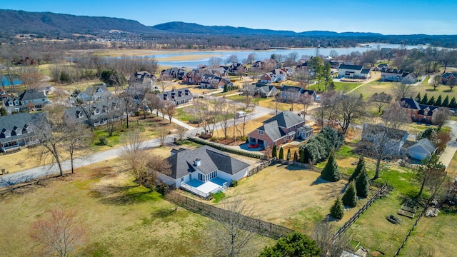 bird's eye view with a residential view and a water and mountain view