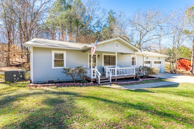 single story home featuring covered porch, a front lawn, and an attached garage