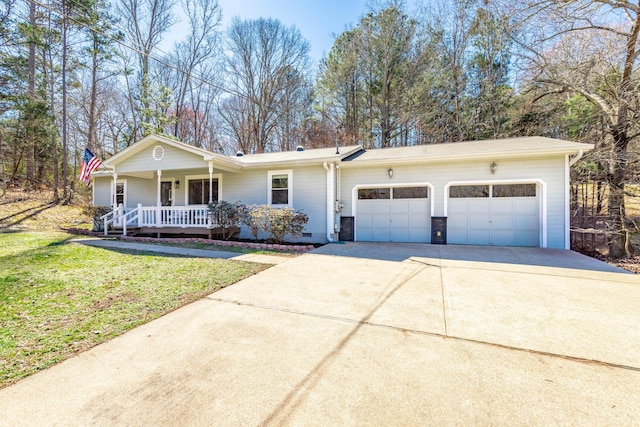 single story home featuring a porch, a garage, driveway, crawl space, and a front yard