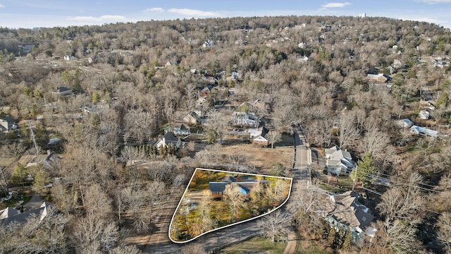 aerial view featuring a wooded view