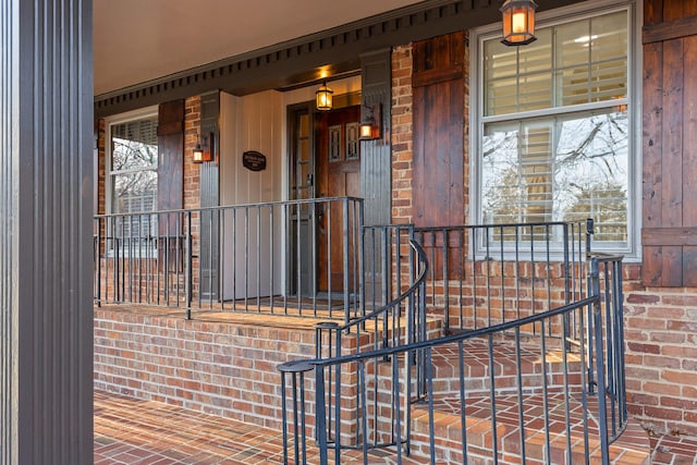 view of exterior entry with covered porch