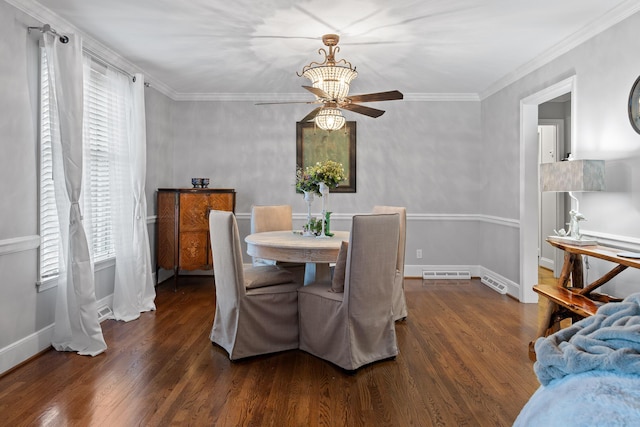 dining room with ornamental molding, wood finished floors, visible vents, and a healthy amount of sunlight