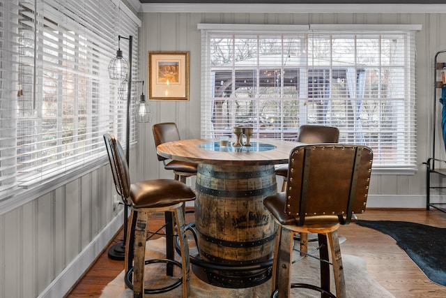 dining area with wood finished floors