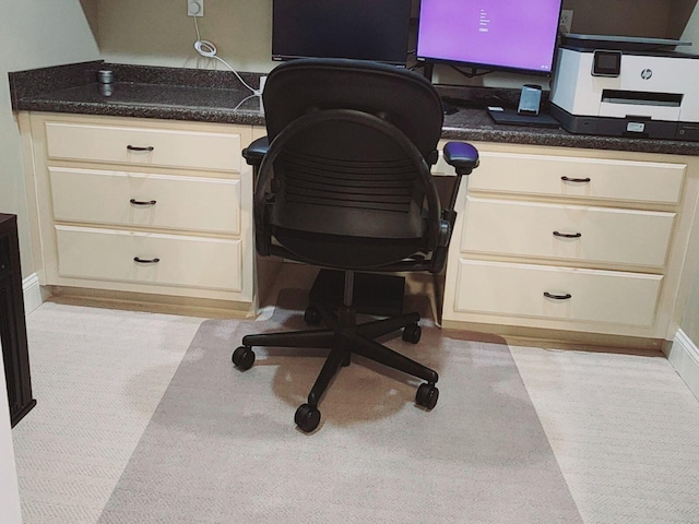 office area featuring built in study area and baseboards