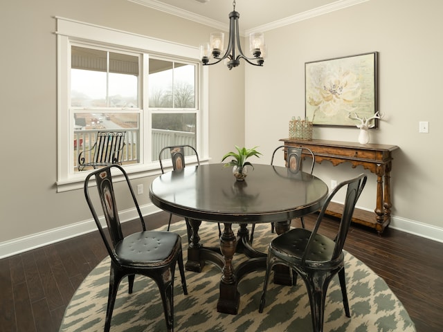 dining area with a notable chandelier, baseboards, dark wood-type flooring, and crown molding