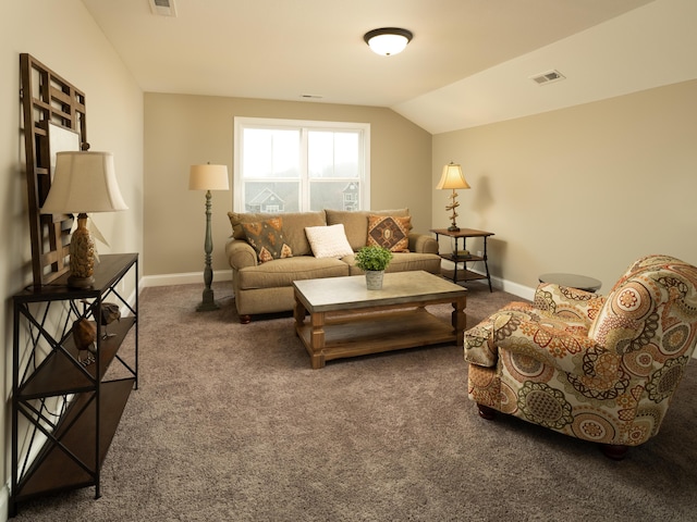 living room featuring lofted ceiling, dark carpet, visible vents, and baseboards