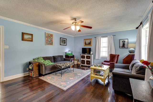 living room with a textured ceiling, dark wood-style flooring, a ceiling fan, baseboards, and ornamental molding