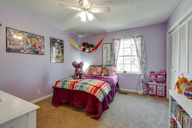 bedroom featuring carpet floors, a closet, visible vents, and baseboards