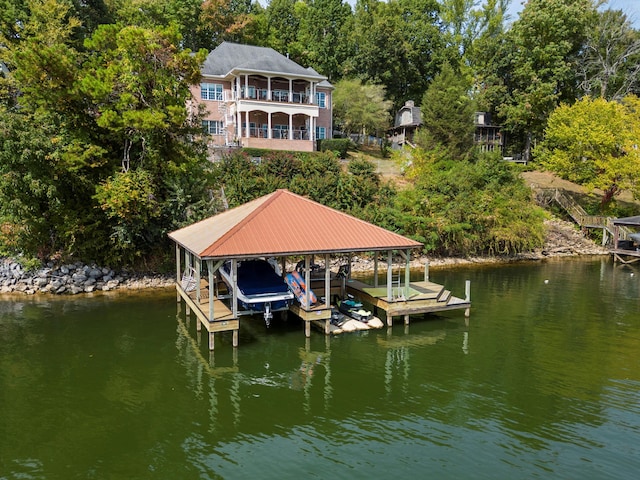 dock area featuring a water view and boat lift