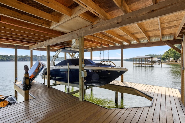 view of dock featuring a water view and boat lift