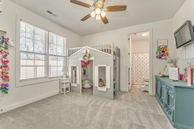 game room featuring light carpet, ceiling fan, visible vents, and baseboards