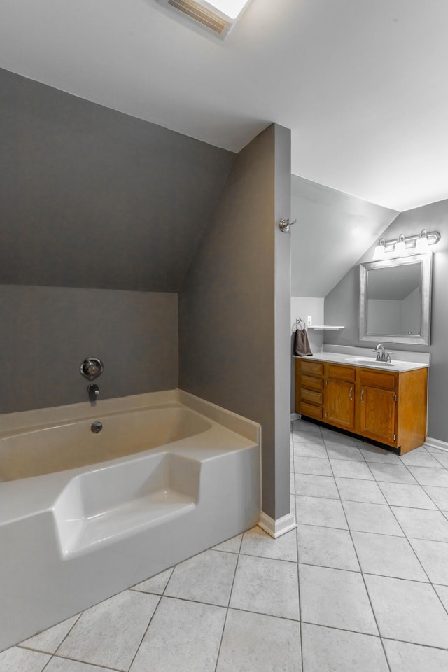 full bathroom with a garden tub, baseboards, vaulted ceiling, tile patterned floors, and double vanity