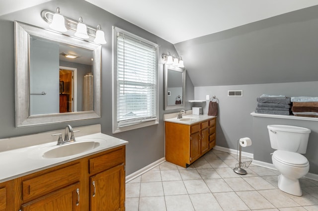 bathroom with visible vents, a sink, toilet, and tile patterned floors