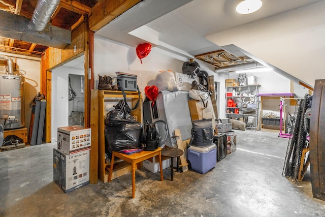 unfinished basement featuring water heater