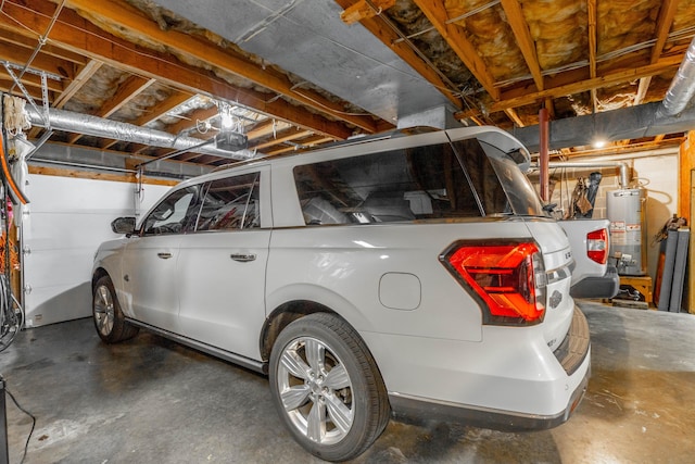 garage with a garage door opener and water heater