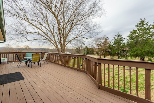 deck featuring outdoor dining area