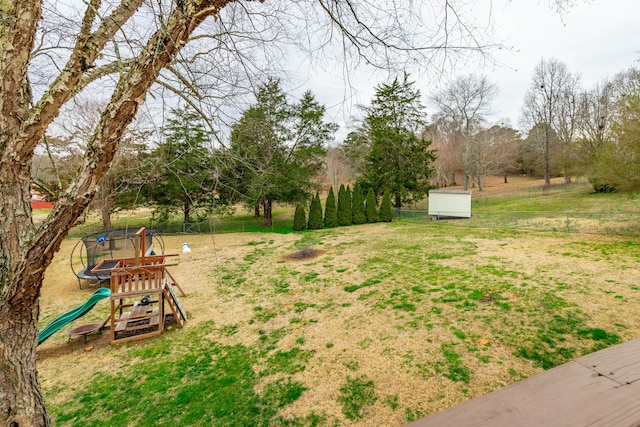 view of yard featuring a shed and a playground