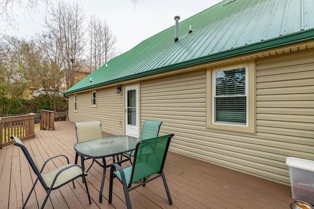 deck with outdoor dining area