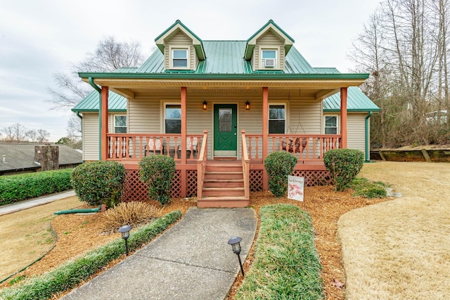 view of front of home featuring covered porch and metal roof