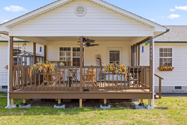 rear view of house featuring roof with shingles, crawl space, and a ceiling fan