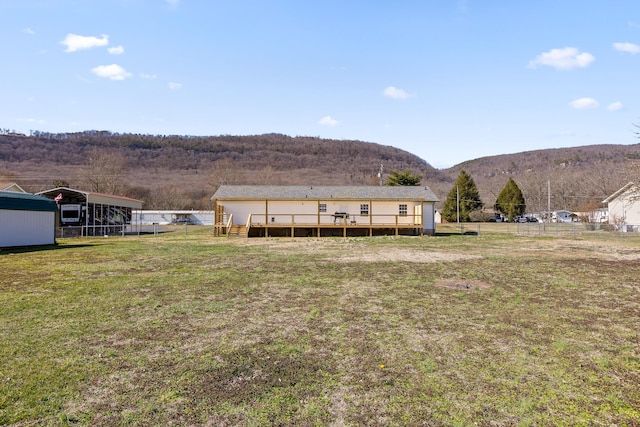 exterior space featuring a deck with mountain view