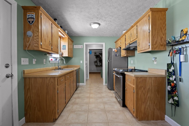 kitchen featuring dishwasher, stainless steel electric range oven, light countertops, under cabinet range hood, and a sink