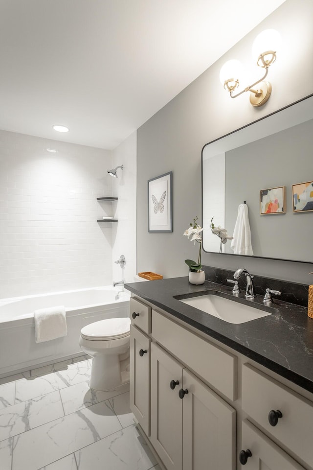 bathroom with marble finish floor, shower / bathing tub combination, vanity, and toilet