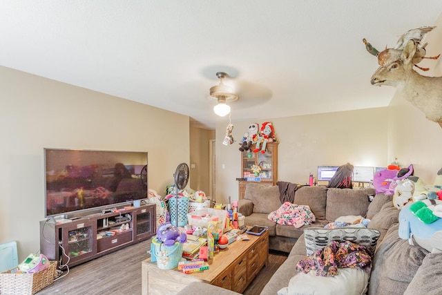 living area featuring ceiling fan and wood finished floors