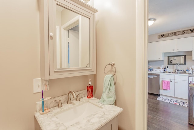 bathroom featuring wood finished floors and vanity