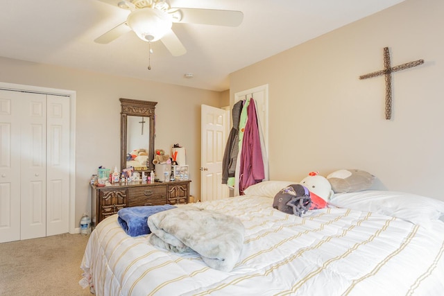 bedroom with light carpet, a closet, and a ceiling fan