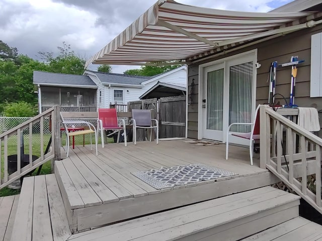 wooden terrace with a sunroom