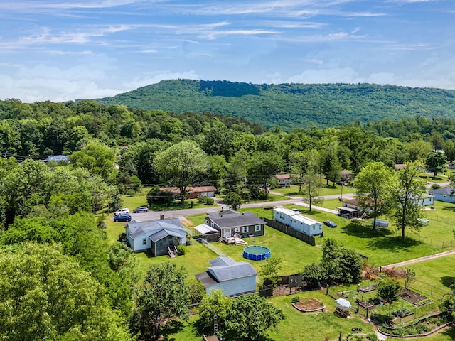 aerial view featuring a wooded view