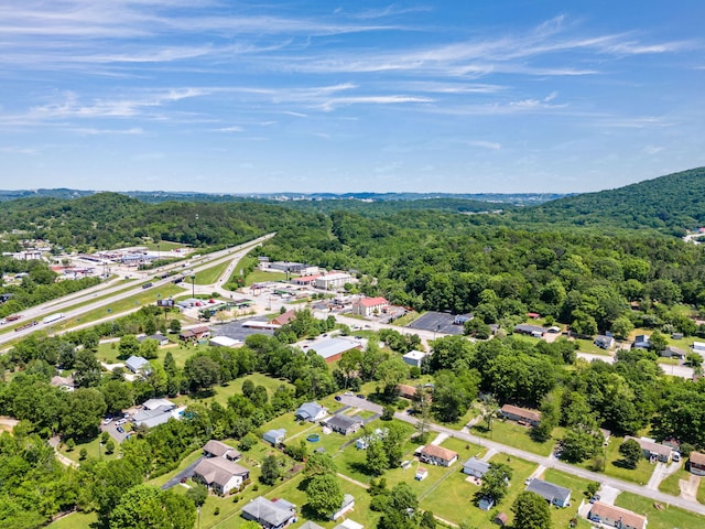 aerial view with a residential view and a view of trees